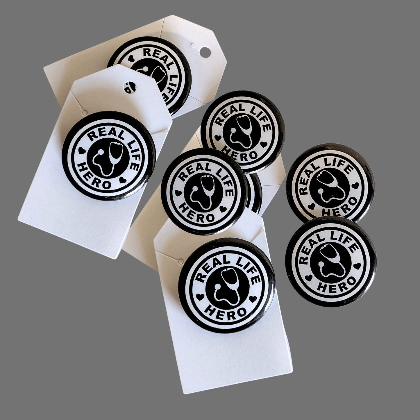 Real Life Hero, Black Pin-Buttons, 1.5" (10-Pk)
