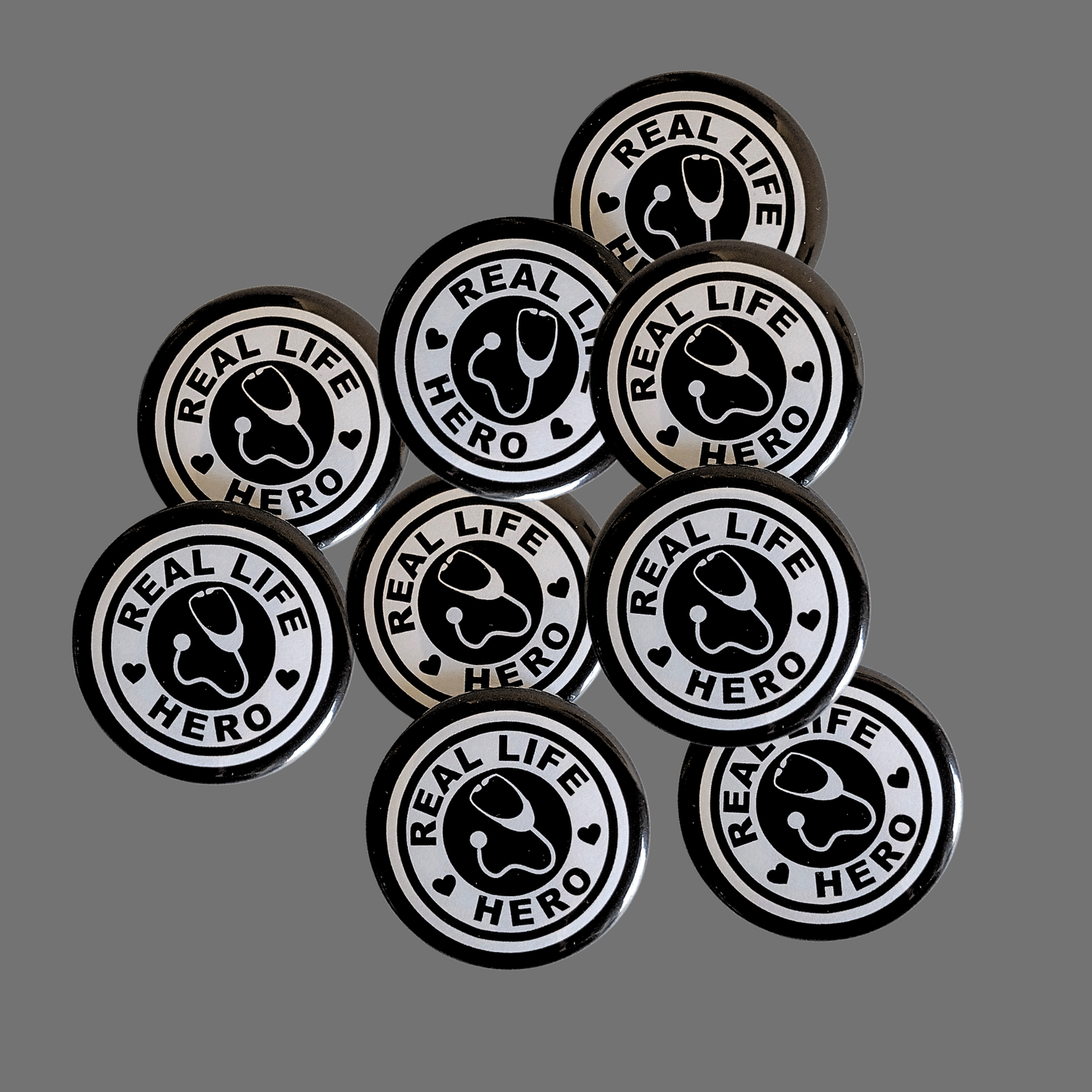 Real Life Hero, Black Pin-Buttons, 1.5" (10-Pk)